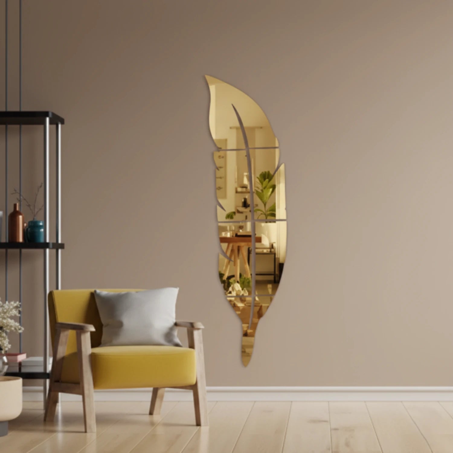 Gold acrylic leaf mirror wall art mounted in a modern living room
